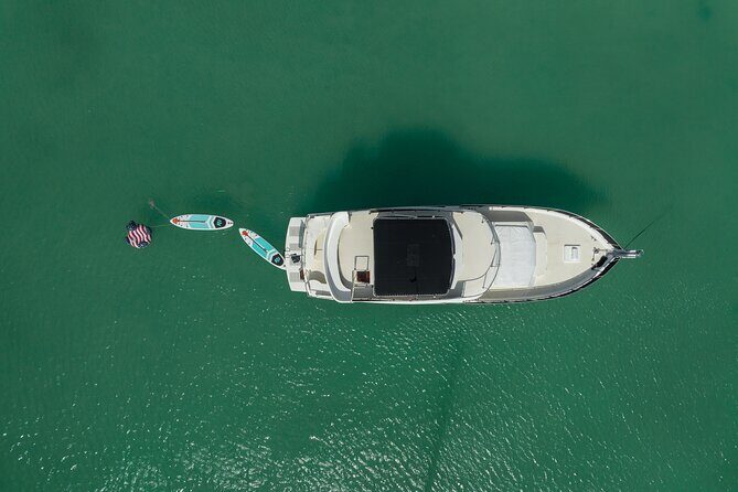 4 Hours - 53' Hatteras - Tulum, Playa Del Carmen, Riviera Maya - Paddleboards, Bluetooth/Spotify, and karaoke for group energy